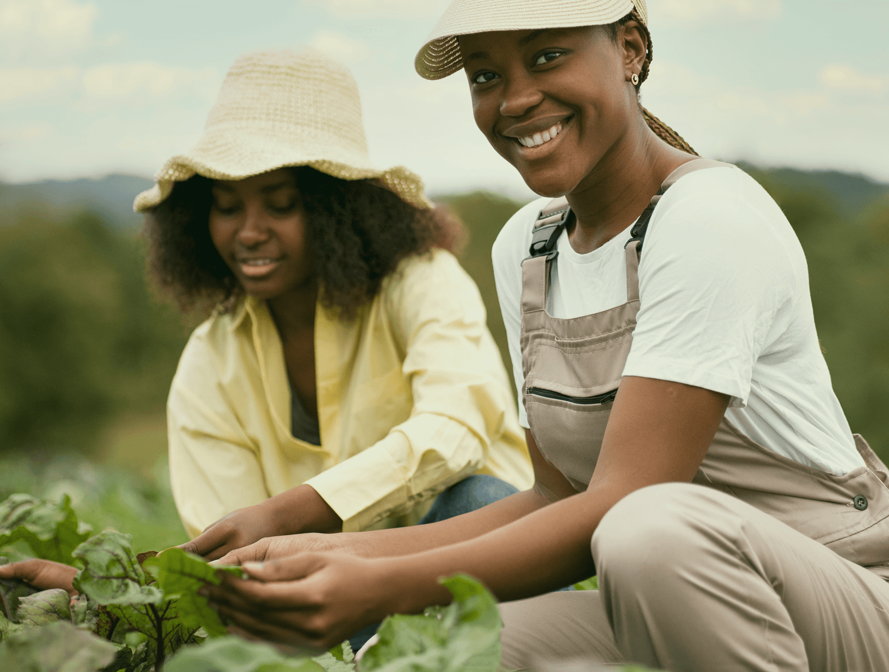Two women farmers in agricultural setting